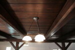 Kitchen's wooden ceiling with chandellier